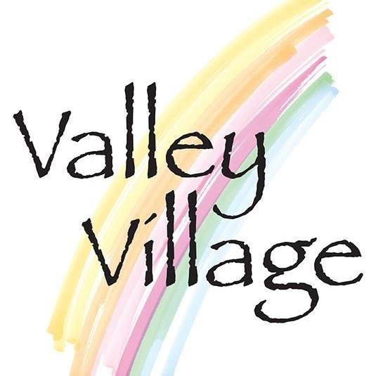 This is a logo of the nonprofit organization, Valley Village.