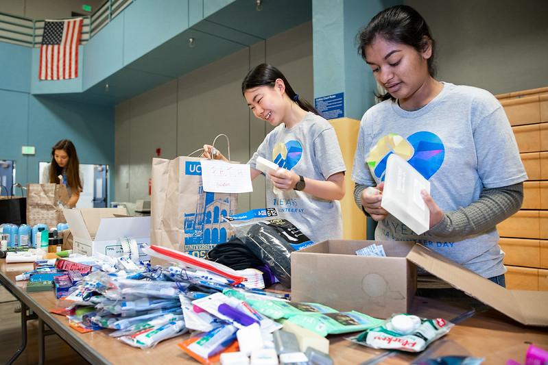 This is a photo of volunteers assembling hygiene kits.