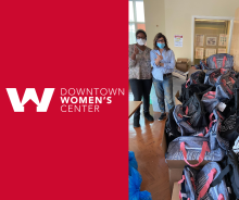 Downtown Women's Center logo on the left and two women standing next to a pile of bags to the right