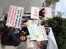 volunteers holding posters