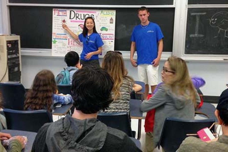 Interaxon members presenting to a class