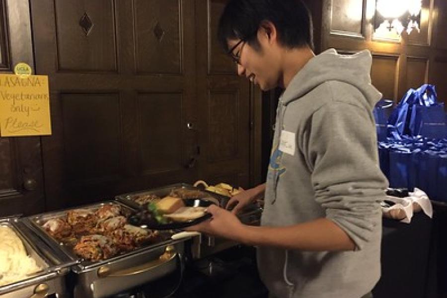 Student serving himself food