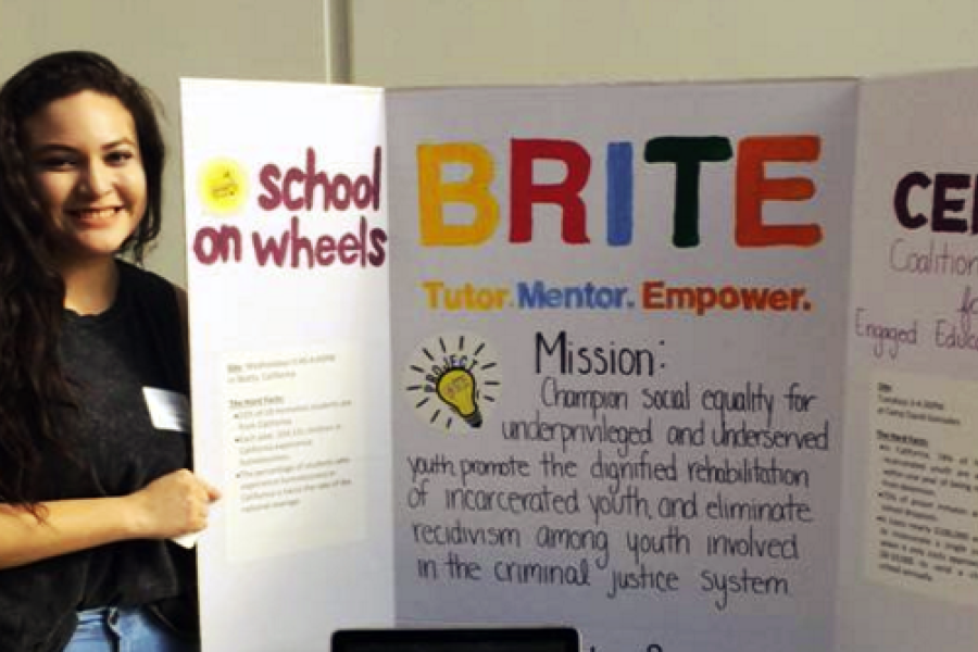 Student with BRITE poster